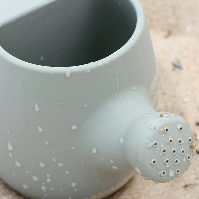 Cherub Baby - Bath & Beach Toys - Silicone Watering Can - Sage with close up of spout at beach
