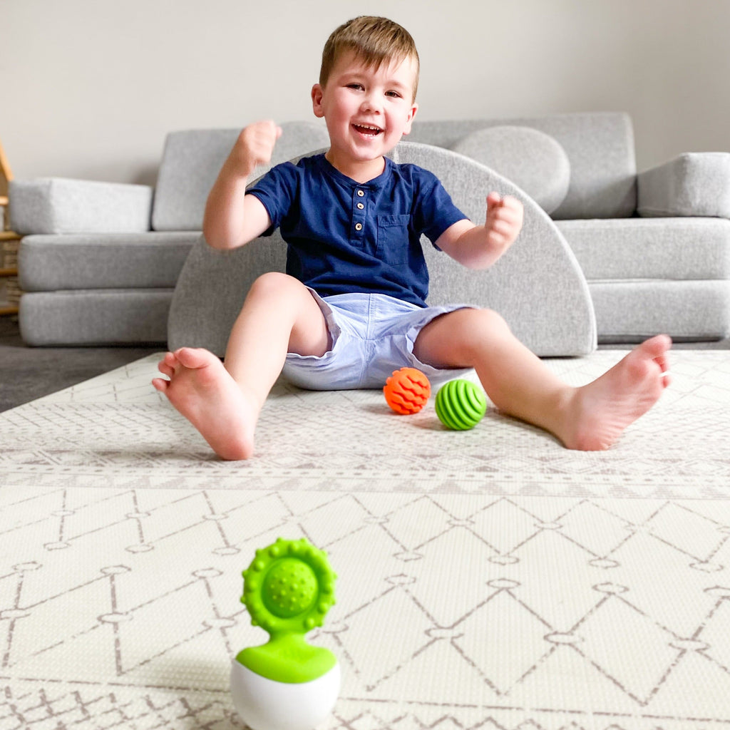 Fat Brain Dimpl Wobl set up game with sensory balls